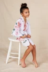Eden White Floral Satin Flower Girl Robe — Seated view