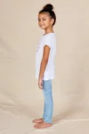 Side view of the flower girl white cotton t-shirt showing the short turned-back sleeve cuff