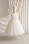 Paige Ivory Tulle Flower Girl Dress by TH&TH - studio front showing the satin bodice and tulle skirt