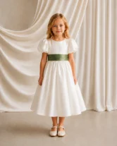 Poppy ivory matte satin flower girl dress by TH&TH with a removable olive grove satin sash tied in a bow, front view