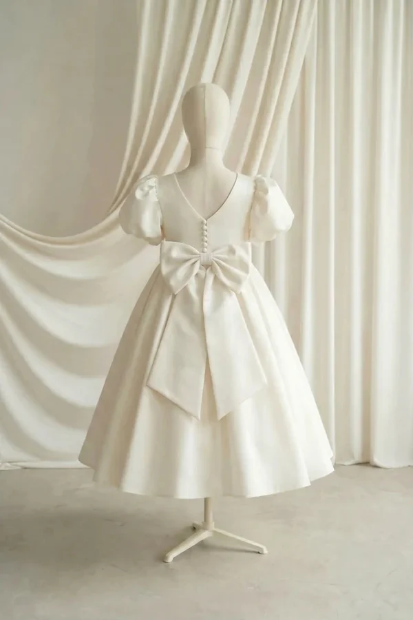 Poppy Ivory Satin Flower Girl Dress by TH&TH — studio back bow detail Poppy Ivory Satin Flower Girl Dress by TH&TH - studio back bow detail