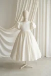Poppy Ivory Satin Flower Girl Dress by TH&TH - studio front detail